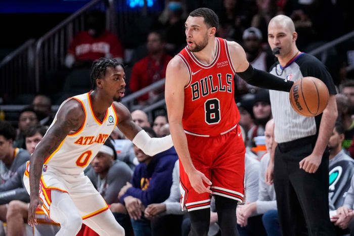 Mar 3, 2022; Atlanta, Georgia, USA; Chicago Bulls guard Zach LaVine (8) controls the ball against Atlanta Hawks guard Delon Wright (0) during the first half at State Farm Arena.